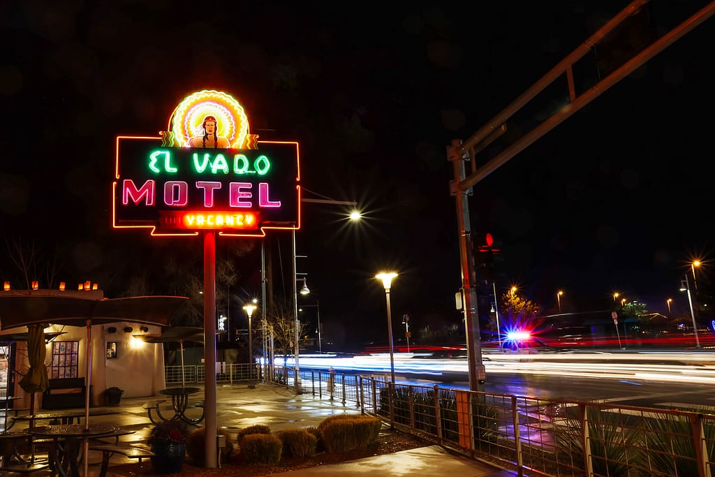 Long exposure of cars streaming by the El Vado Motel on historic Route 66 in Albuquerque, New Mexico.