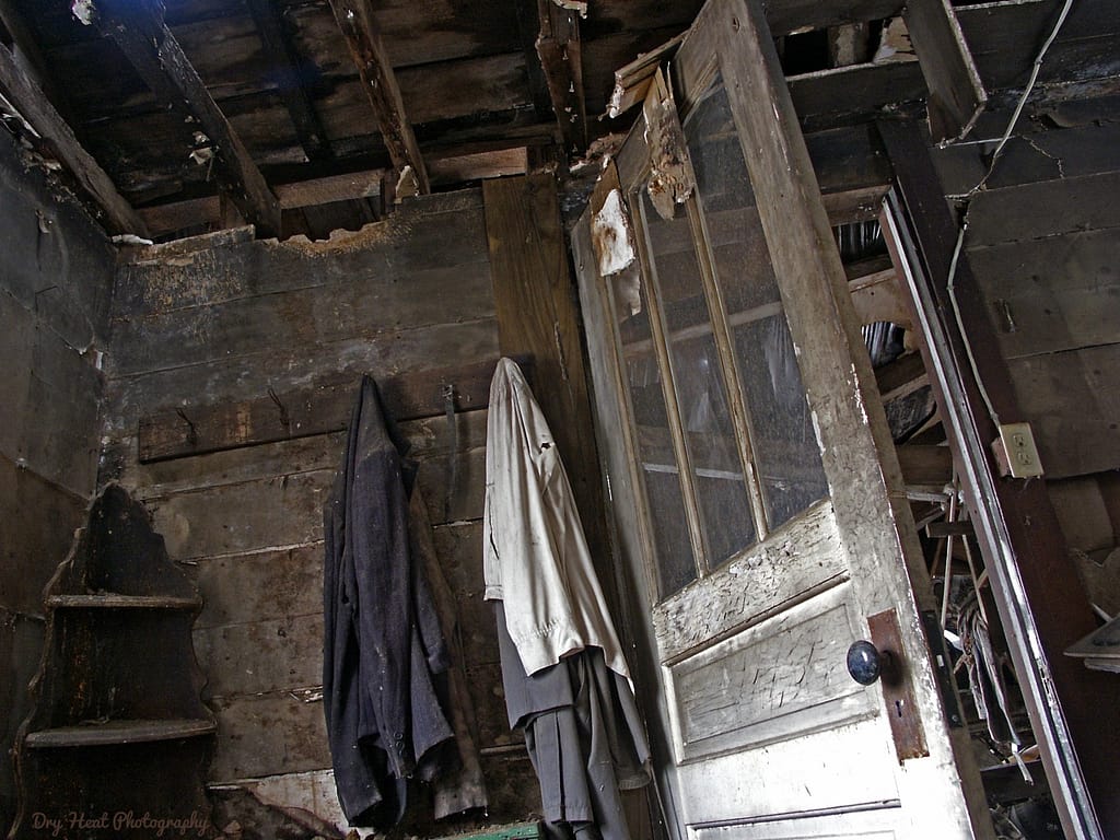 Coats still hang on hooks in this abandoned house in Navarino, Wisconsin.
