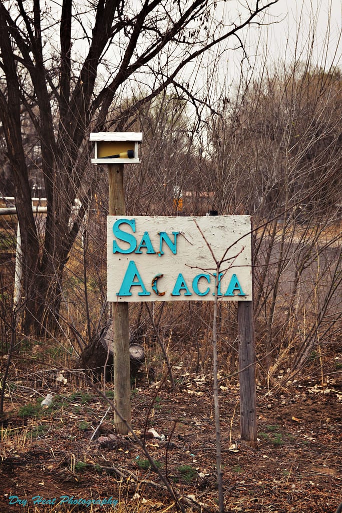 A sign welcoming visitors to the town of San Acacia, New Mexico.
