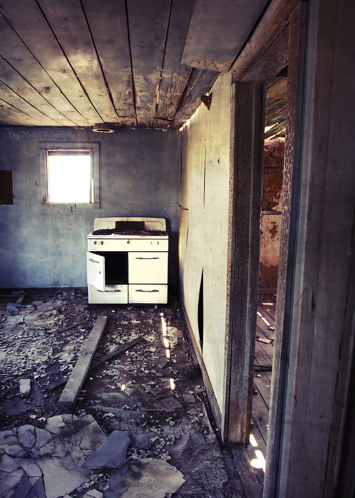 Old stove inside an abandoned house in Cedarvale, New Mexico